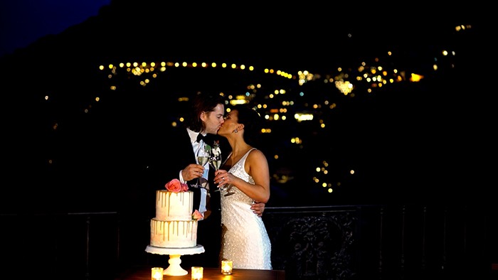 Villa Treville wedding video Positano, Italy. The bride and groom at the cutting of the cake with behind the wonderful Positano by night.